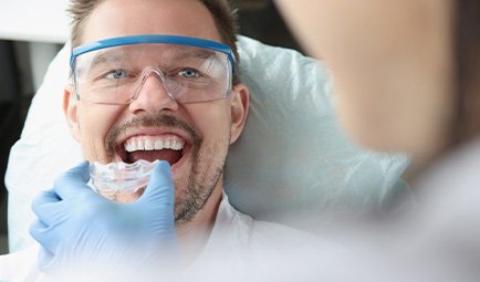 A man getting a nightguard made by a dentist