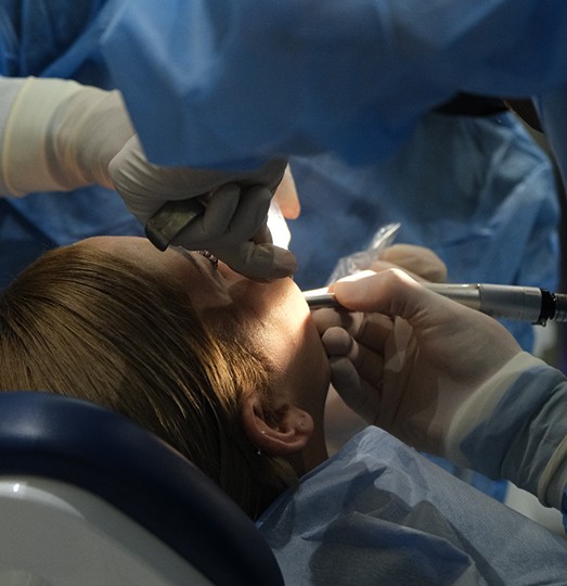Woman getting dental surgery