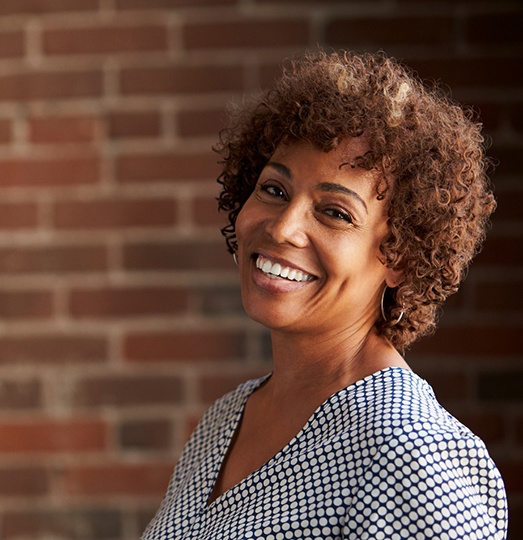 woman smiling with dental bridge in Baltimore