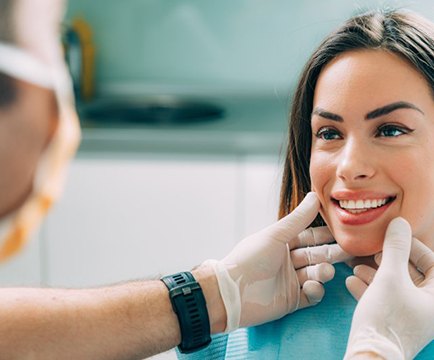 Dentist examining his patient’s teeth