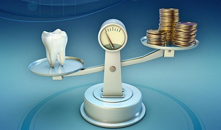 Tooth and money on balance scale