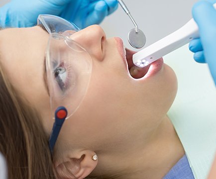 Dentist capturing images with intraoral camera