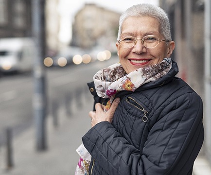 Woman smiling with dentures in Baltimore