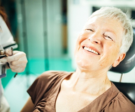 Older woman leaning back in the dental chair