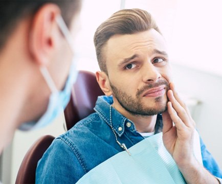 man speaking with an emergency dentist in Baltimore