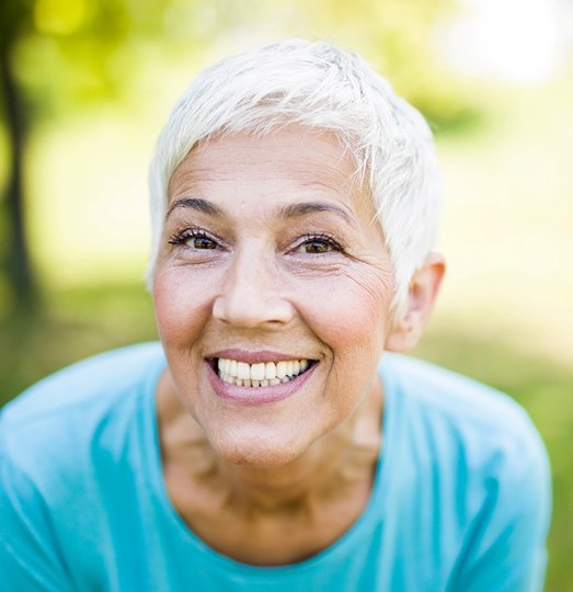 A sporty senior woman at the park