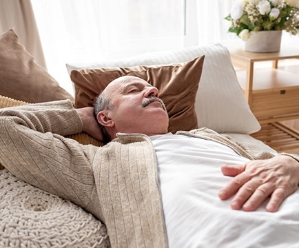 Man resting on a couch