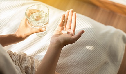 Woman taking a pill