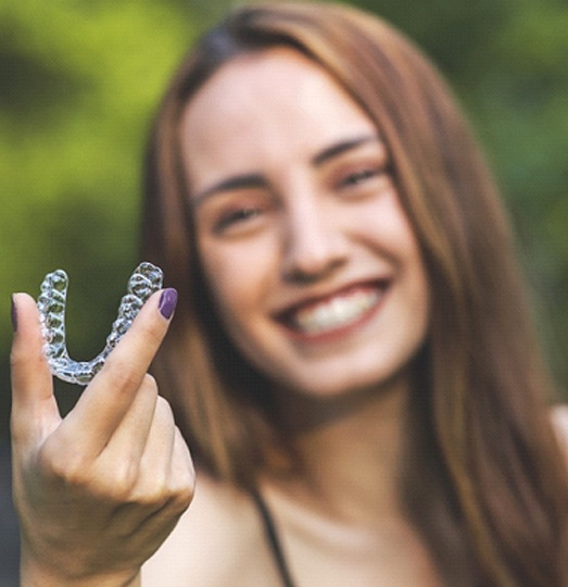 Woman smiling with Invisalign in Baltimore