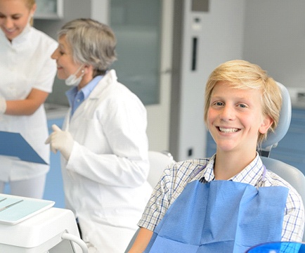 Teenager at dentist getting Invisalign in Baltimore