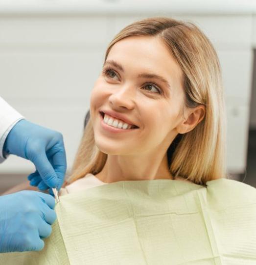 Happy patient looking up at her dentist