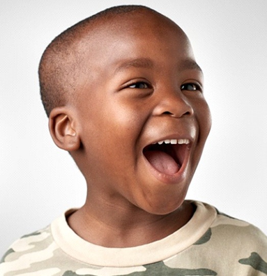 Young boy smiles after lip and tongue-tie treatment in Baltimore