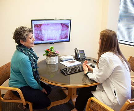 Doctor Ward and patient looking at smile images