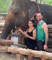 Doctor Ward and her husband standing next to an elephant