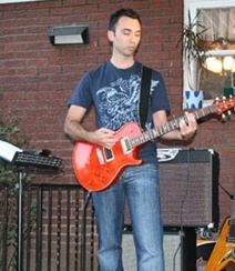 Doctor Ward playing guitar