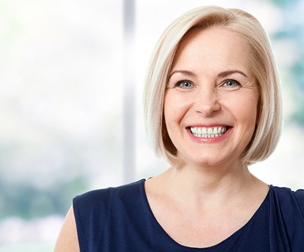 Woman with healthy smile after deep cleaning