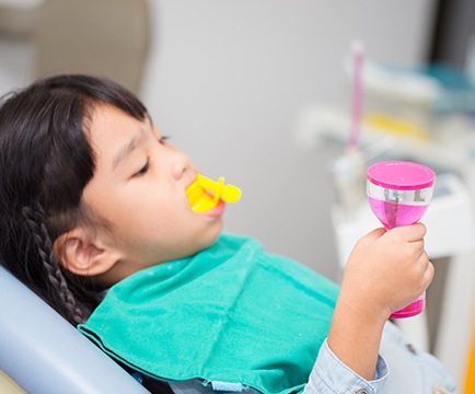 Child receiving fluoride treatment