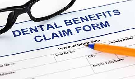 Woman listening to dentist discuss treatment options