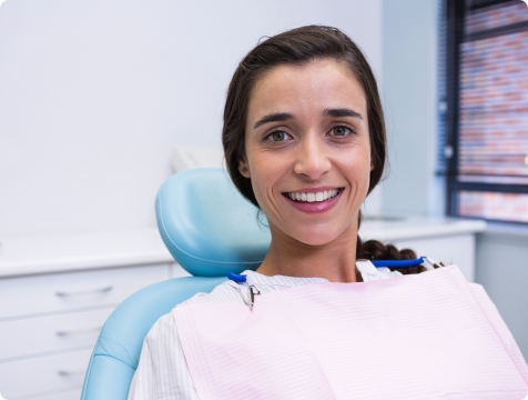 Woman smiling during preventive dentistry visit