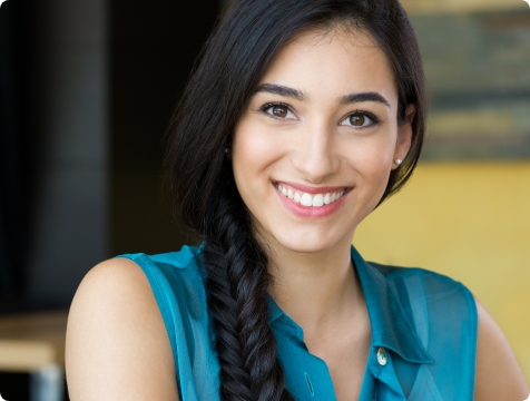 Woman with healthy teeth and gums after periodontal therapy