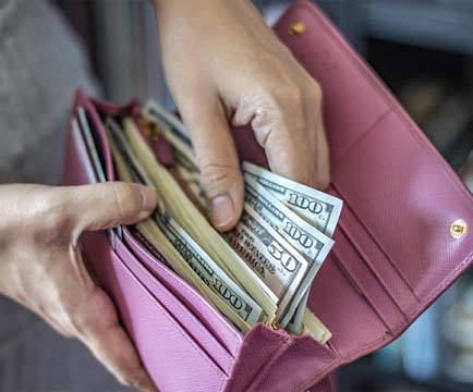 Wallet full of money for veneers in Baltimore