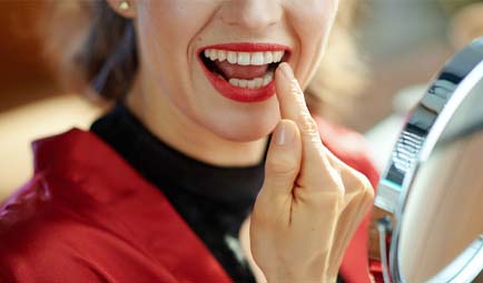 Closeup of woman smiling after seeing cosmetic dentist in Baltimore