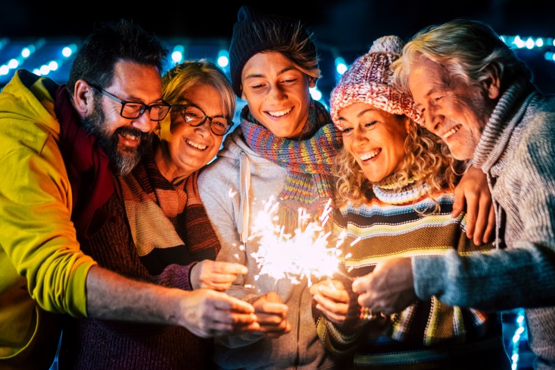 a family smiling and enjoying New Year’s Eve in Baltimore