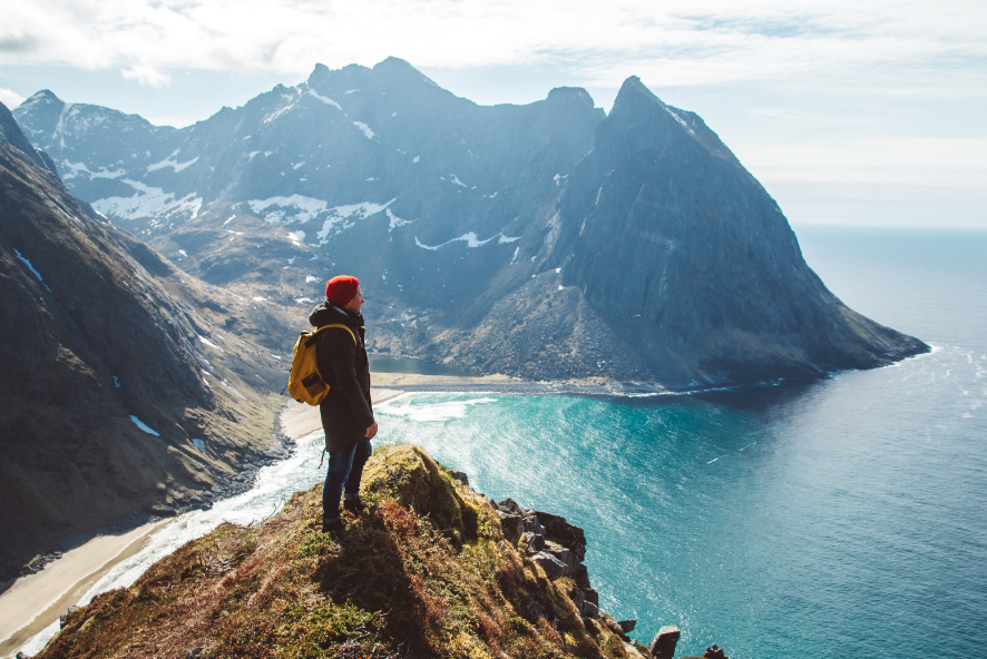 Backpacker standing on mountain top